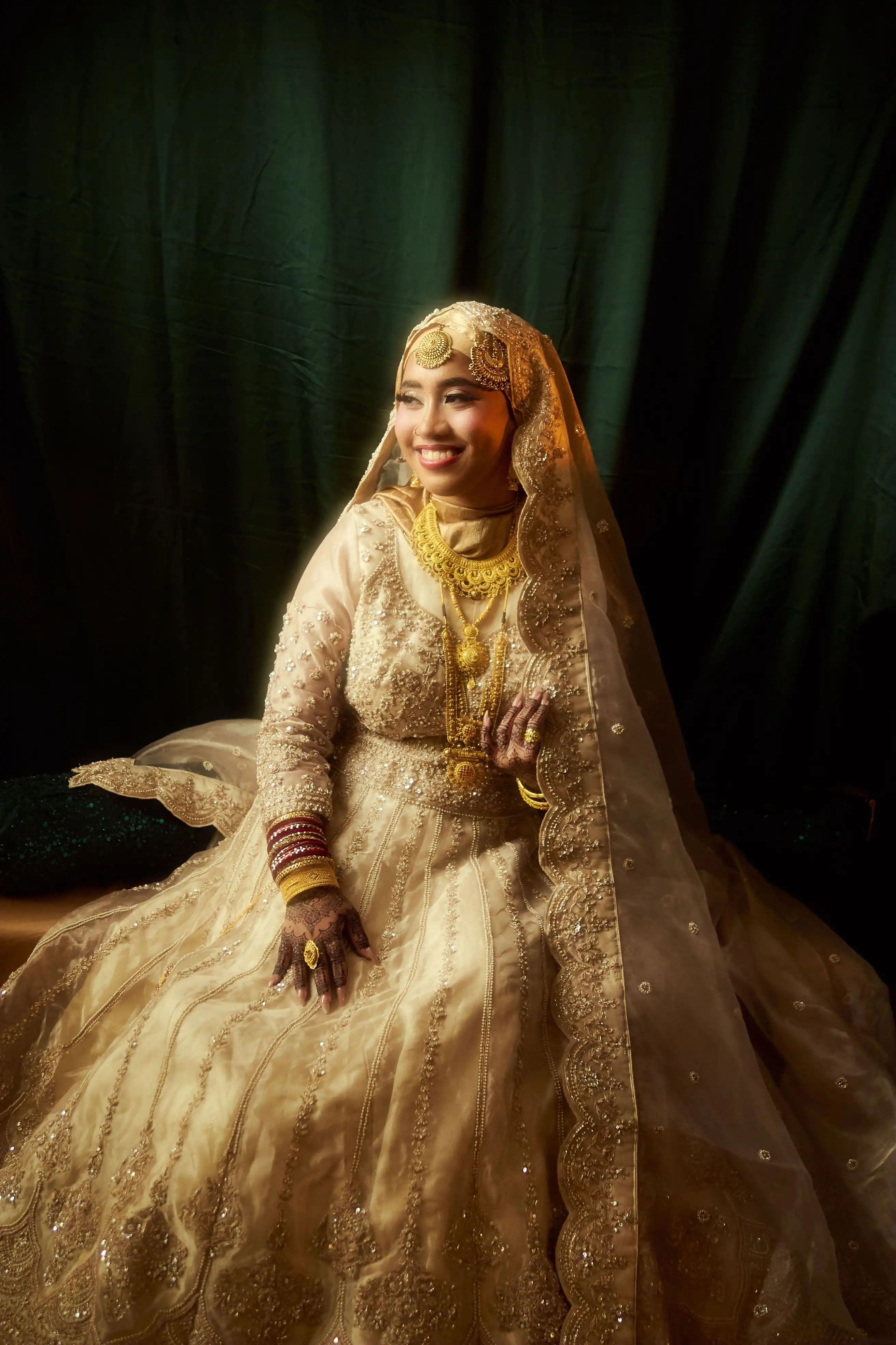 Bride in gold smiling warmly